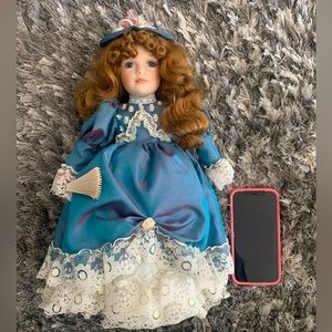 Vintage porcelain doll with stand